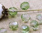 10 Böhm. Glass cut beads 6 mm light green clear
