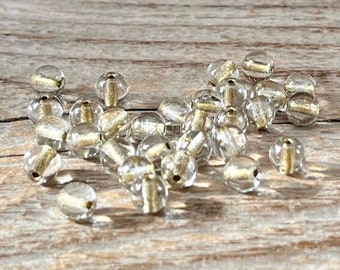 30 böhmische MINI Glasperlen 5mm rund klar transparent mit Goldeinzug golden lined