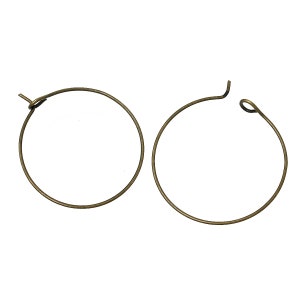 May include: A pair of gold-toned hoop earrings. The earrings are simple and elegant, with a smooth finish.
