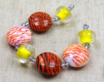 1 Strang Lampwork Perlen STRIPES orange gelb weiß