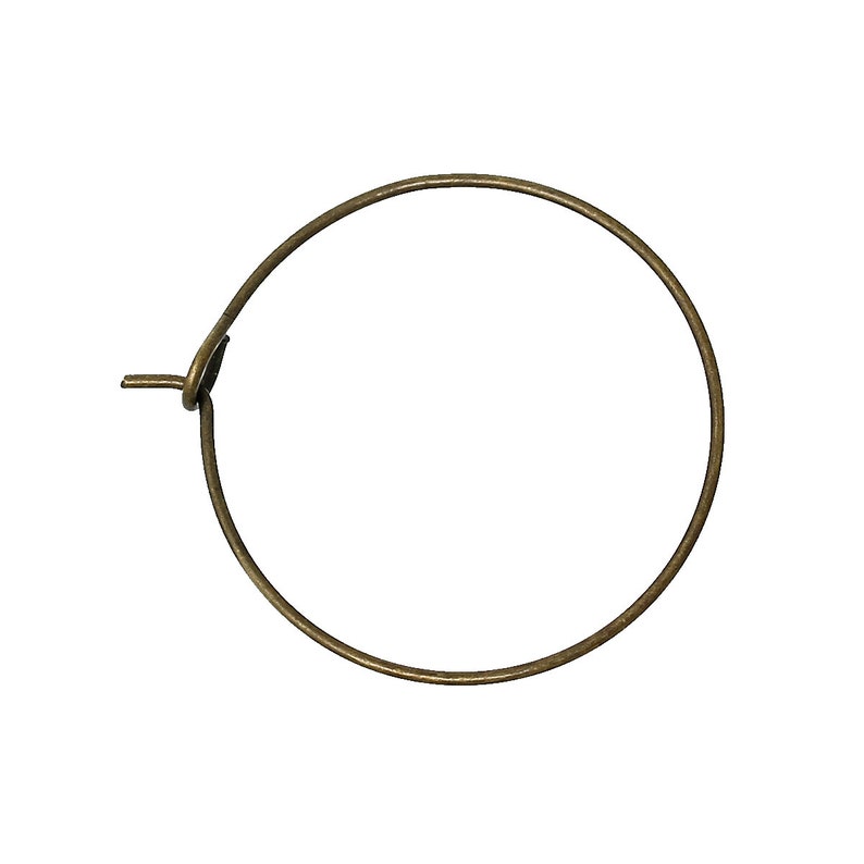May include: A simple, round, gold-toned hoop earring with a small, hinged closure.