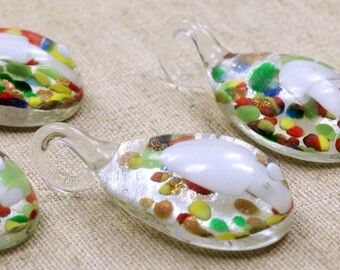 May include: Four glass charms with a white centre and colourful confetti-like designs. Each charm has a loop for hanging.