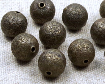 10 STARDUST Perlen - 12mm - Metallperlen, BRONZE