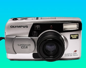 Olympus Superzoom 105R Film dazu und los Fotografieren