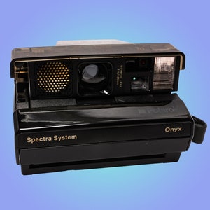 Câmera Polaroid Onyx Spectra legal transparente veja o interior limpo com controle remoto e close-up