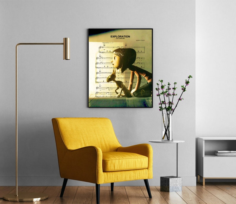 May include: A framed print of a girl and a dog looking up at a sheet of music with the word "EXPLORATION" at the top. The print is hanging on a white wall in a room with a yellow armchair, a floor lamp, and a vase of flowers on a side table.
