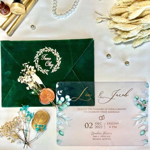 Wedding Invitation. Luxury Green Velvet Envelope with Elegant Acrylic Invitation and Luxury Gold Foil Wax Seal. Stylish Floral Patterns.