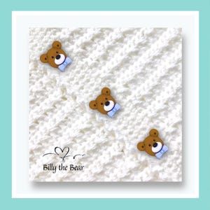 May include: Three brown bear-shaped buttons with blue bow ties are scattered on a white, textured background. The text "Billy the Bear" is at the bottom left corner of the image.