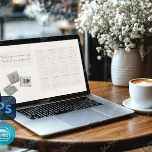 May include: A laptop computer with a white background and a calendar on the screen. The text "today is going to be amazing" is displayed on the screen. The laptop is on a wooden table with a cup of coffee and a bouquet of white flowers.