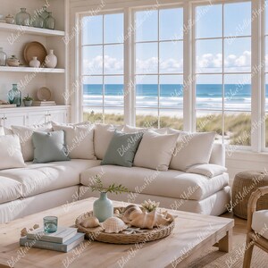 May include: A bright, airy living room with a coastal theme. A large white sectional sofa is adorned with light blue and cream pillows. A wooden coffee table displays seashells and decorative items. Large windows offer a view of the ocean.
