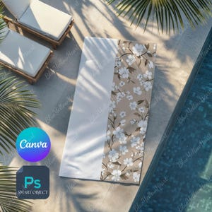 May include: A white and floral beach towel with a beige floral pattern. The towel is rectangular and lies on a concrete surface near a pool. The towel has a white section and a beige section with white flowers. The Canva and Smart Object logos are visible.
