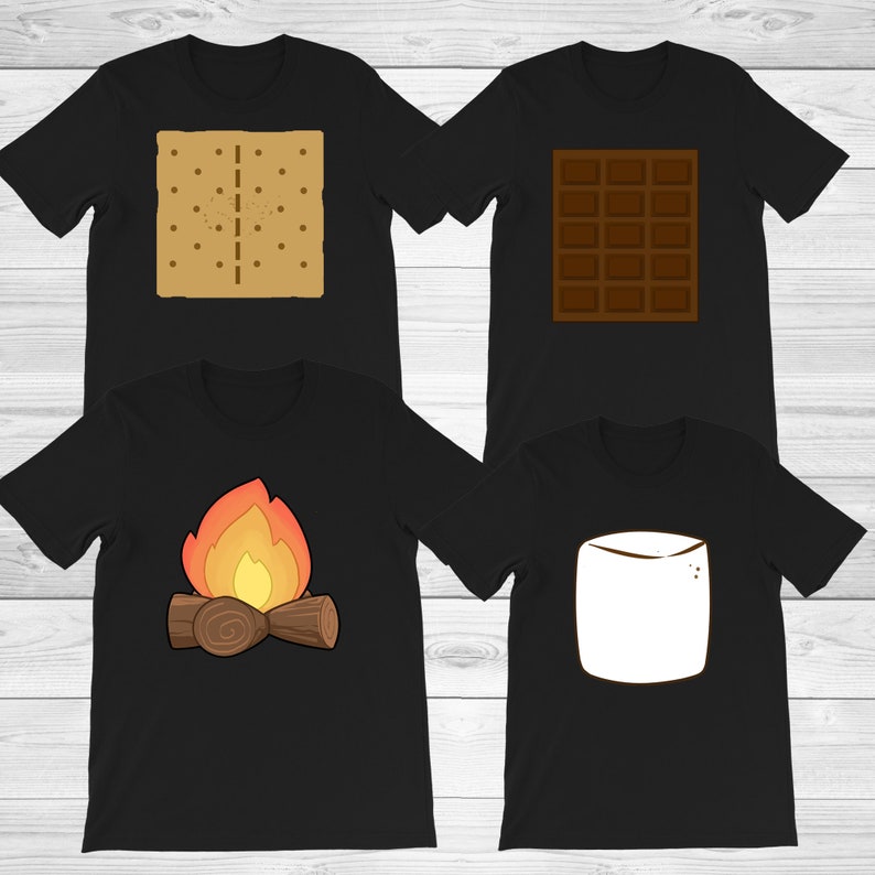 May include: Four black t-shirts with s'mores-themed graphics. One shirt features a graham cracker, another a chocolate bar, a third a campfire, and the last a marshmallow. The graphics are in shades of brown, orange, and white.