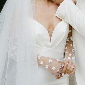 Kerry Parker Gloves with hand embroidered vows. Embellished with handmade flowers and pearls on them.