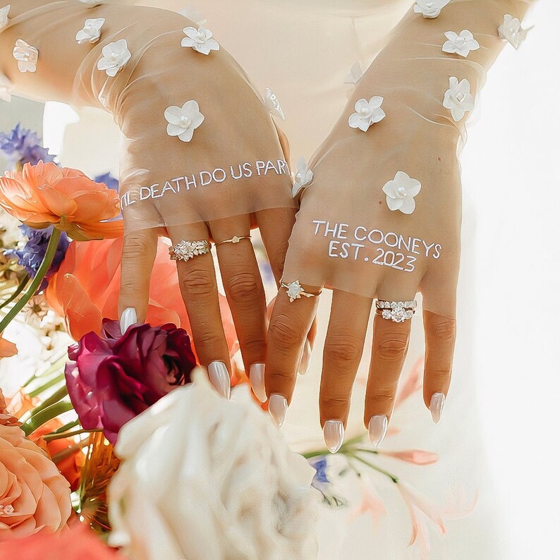 Kerry Parker Gloves with hand embroidered vows. Embellished with handmade flowers and pearls on them.