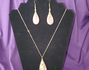 Necklace featuring hand-crafted ceramic beads and a heart-shaped pendant