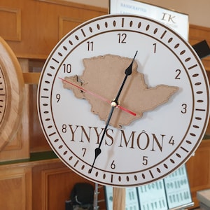 YNYS MON Quartz CLOCK.  Wall mounted. Engraved white coated mdf