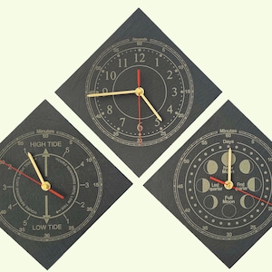 May include: Three diamond-shaped slate clocks with gold hands and red second hands. One clock shows standard time, another displays high and low tide, and the third indicates the phases of the moon.