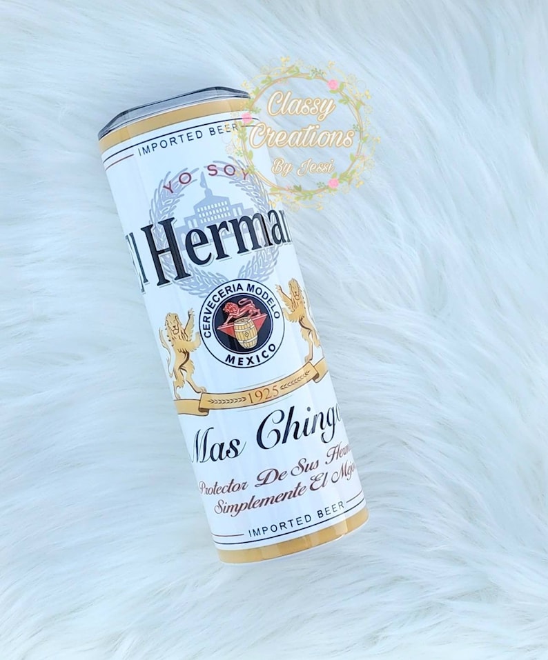 May include: White and gold can with the text "IMPORTED BEER" and "Mas Ching" with a crest featuring a lion and the text "Cerveceria Modelo" and "Mexico".