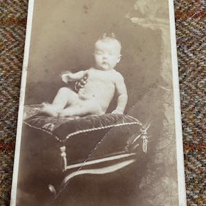 Rare Antique British CDV photograph. Original Victorian Photo of a baby held by a hidden mother. English Carte De Visite of a child
