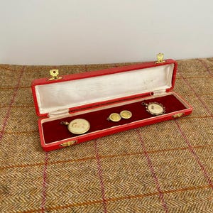 Three Antique items of Mourning Jewelry. Victorian Photo locket pendants in a vintage jewellery box