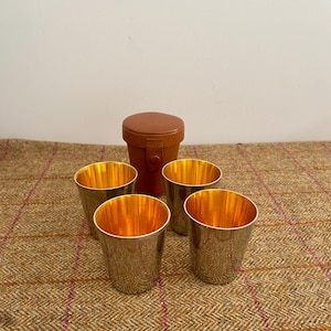 Set of four vintage metal stacking cups in case. Picnic travel beakers