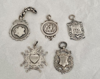 Five Vintage Silver Hallmarked pendant medals. Watch Fob medals