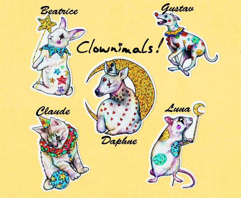 May include: Five colorful stickers featuring animal illustrations with clown-like costumes and names. The stickers feature a rabbit, a dog, a deer, a cat, and a rat. The text "Clownimals!" is written in black cursive.