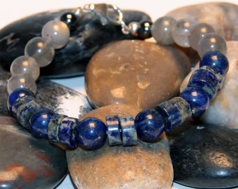 Lapis and Labradorite 8mm beads with Hematite. Fastens with a .925 Sterling Silver Lobster Claw Clasp.