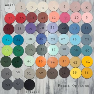 May include: A chart of 59 paint color swatches, numbered 1 through 59. The swatches are arranged in rows and columns. The colors range from white to black, with shades of red, orange, yellow, green, blue, purple, and brown. The text "white" and "Black" are written on the chart.