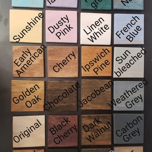 May include: A color chart of 20 different wood stains, including Aqua, Sunshine, Lavender, Dusty Pink, Cherry, Early American, Golden Oak, Original, Black Cherry, Special Walnut, Ebony, Chocolate, Forest Green, Linen White, Ipswich Pine, Sun Bleached, Jacobean, Weathered Grey, Dark Walnut, Carbon Grey, Espresso, and Briar Smoke.