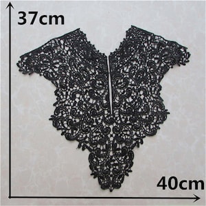 May include: Black lace trim with a scalloped edge, measuring 37 inches by 40 inches. This trim is perfect for adding a touch of elegance to any project.