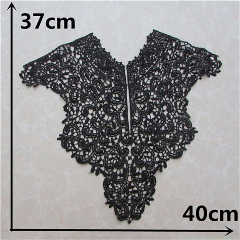 May include: Black lace trim with a scalloped edge, measuring 37 inches by 40 inches. This trim is perfect for adding a touch of elegance to any project.