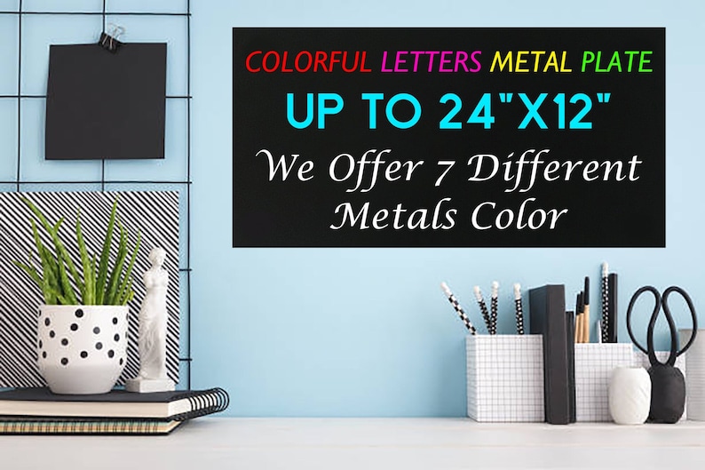 May include: A black rectangular metal plate with the text COLORFUL LETTERS METAL PLATE UP TO 24"X12" We Offer 7 Different Metals Color. The sign features multi-colored text and is displayed against a light blue wall with office desk accessories.