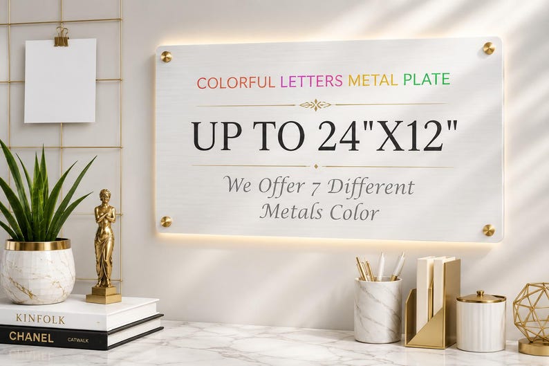 May include: A rectangular metal plate with a brushed silver finish, mounted with four gold-toned standoffs. The text reads: COLORFUL LETTERS METAL PLATE, UP TO 24"X12", and We Offer 7 Different Metals Color, featuring a decorative gold line element.