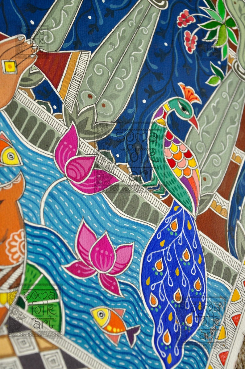 May include: A colourful folk art painting featuring a peacock with a blue tail, pink lotus flowers, and orange fish swimming in a blue river. The painting is executed in a traditional Indian style with intricate details.