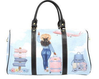 May include: A travel duffel bag with a light blue background featuring a woman with a suitcase, a pink airplane, and a signpost with travel-related words. The bag has black handles and trim.