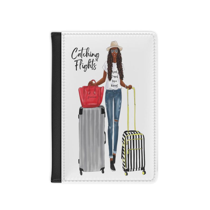 May include: A white passport holder with a black border. The front of the holder features a colorful illustration of a woman with a suitcase and a handbag. The text "Catching Flights" is printed in black on the front of the holder.