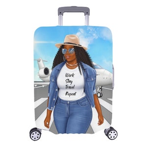 May include: A luggage cover featuring a digital illustration of a woman wearing a denim jacket, a white t-shirt with the text "Work Slay Travel Repeat", a straw hat, and sunglasses. The woman is standing on a runway in front of a private jet against a blue sky background.