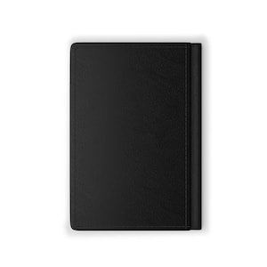 May include: A black leather notebook with a stitched edge.