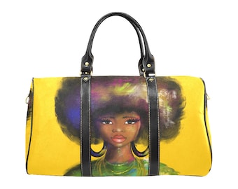 May include: Yellow duffel bag featuring a vibrant portrait of a woman with a large afro. The artwork includes colorful accents and large hoop earrings. The bag has black leather handles and trim.