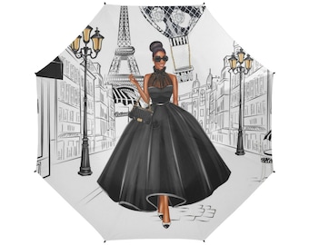 May include: A black and white illustration of a woman in a black dress walking in Paris. The Eiffel Tower is in the background and a hot air balloon is in the sky.