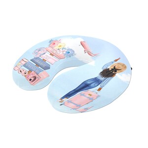 May include: A blue and white travel neck pillow with a cartoon illustration of a woman with a suitcase and a sign that says "Adventure, Holiday, Trip".