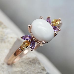 Breastmilk ring rose gold plated over 925 sterling silver core. Breastmilk oval stone and leaf shaped crystals in rose gold. KeepsakeMom