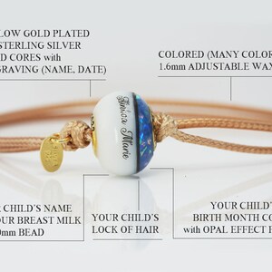 breastmilk jewelry bead 16x10mm with half sapphire birth color and opal flakes, half milk with child name, and lock of hair in the middle with yellow gold plated sterling silver cores and light brown adjustable cord bracelet from KeepsakeMom