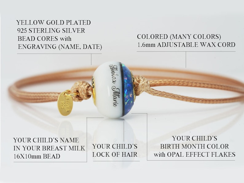 breastmilk jewelry bead 16x10mm with half sapphire birth color and opal flakes, half milk with child name, and lock of hair in the middle with yellow gold plated sterling silver cores and light brown adjustable cord bracelet from KeepsakeMom