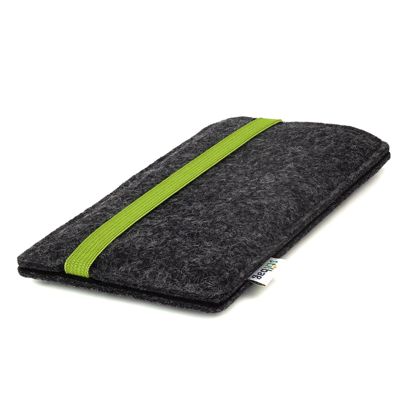 May include: A gray felt phone case with a green elastic band and the word "Squishable" printed on the side.