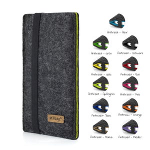 May include: A gray felt phone case with a black elastic band and a lime green trim. The case has the word "stilbag" printed on it. The image shows different color options for the trim, including blue, green, yellow, red, pink, orange, brown, and purple.