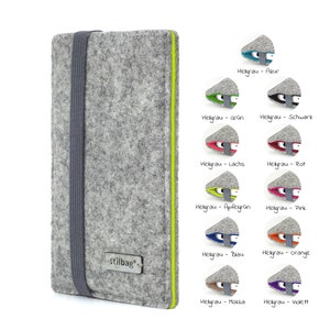 May include: A gray felt phone case with a lime green border and a gray elastic band. The case has the word "stilbag" printed on it. The image shows 12 different color options for the case.