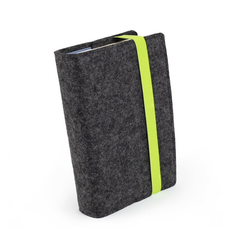 May include: A gray felt book cover with a bright green elastic band closure.