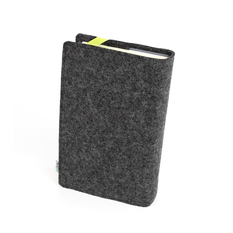 May include: A gray felt book cover with a yellow bookmark.